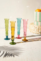 SET OF FOUR WAVY TRUMPET CHAMPAGNE GLASSES - ONE EACH COLOR