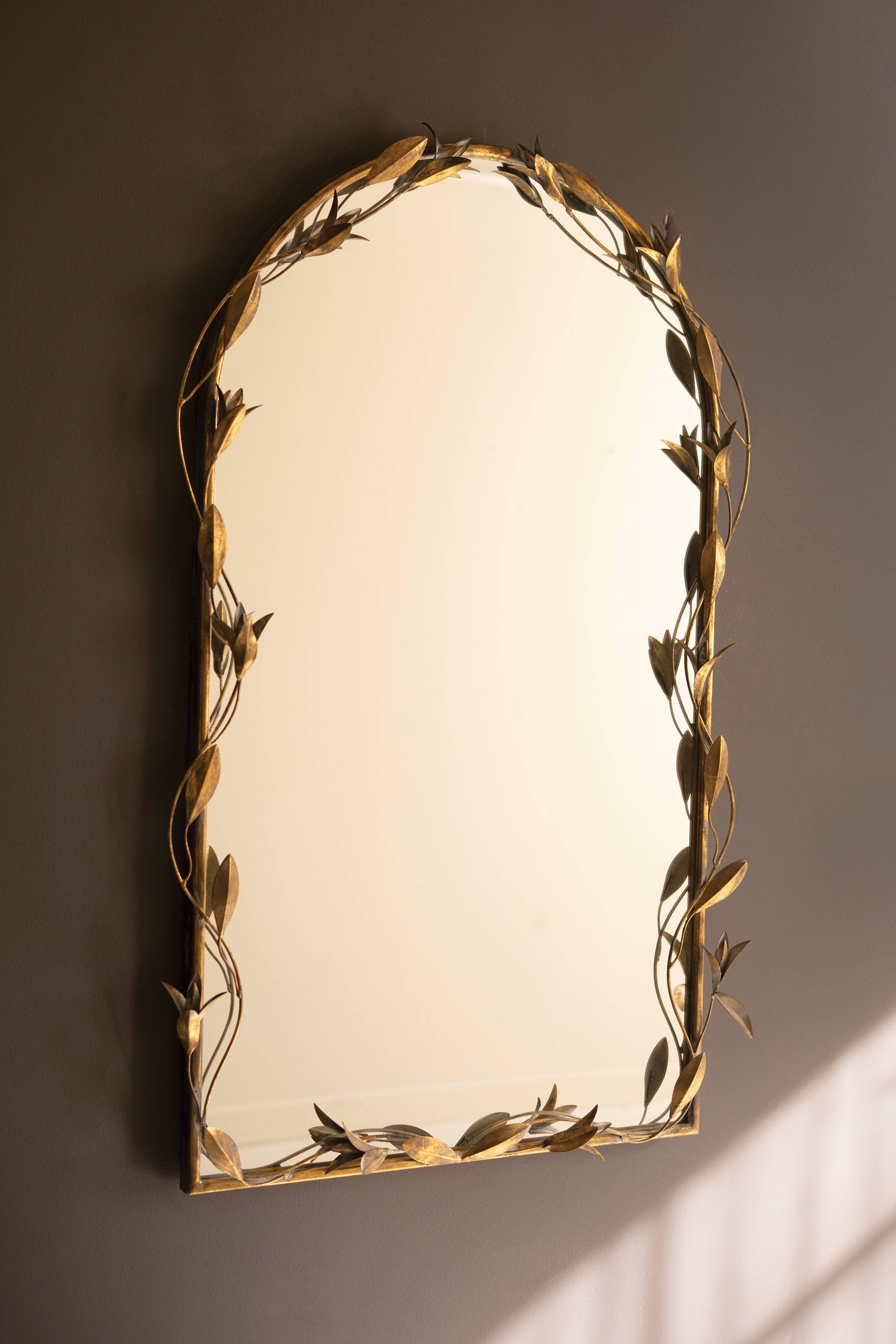 TALL ARCHED ANTIQUE BRASS FRAMED MIRROR WITH LEAVES