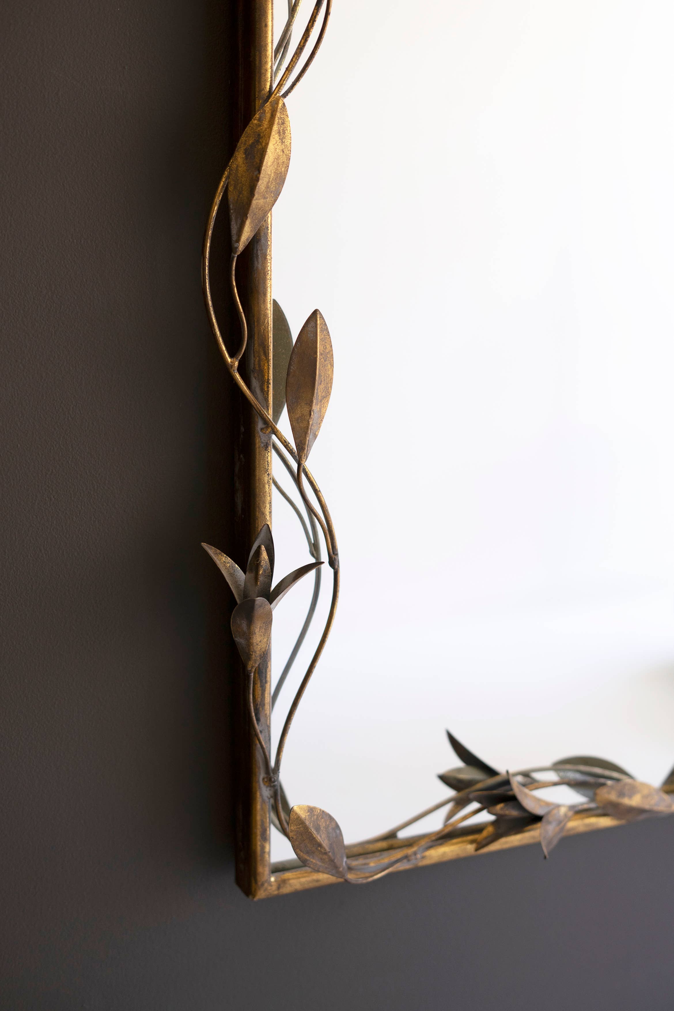 TALL ARCHED ANTIQUE BRASS FRAMED MIRROR WITH LEAVES