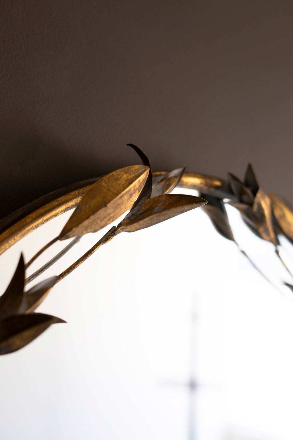TALL ARCHED ANTIQUE BRASS FRAMED MIRROR WITH LEAVES